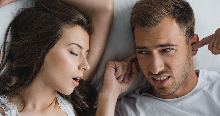 A man being kept awake by a snoring woman